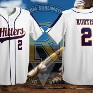 A white baseball jersey with navy blue accents. The front features "Hitters" in an orange script font with the number "2" below, and the back displays "KURTIS" above the number "2". The jersey is designed for sublimation printing, with a baseball field and bat in the blurred background.