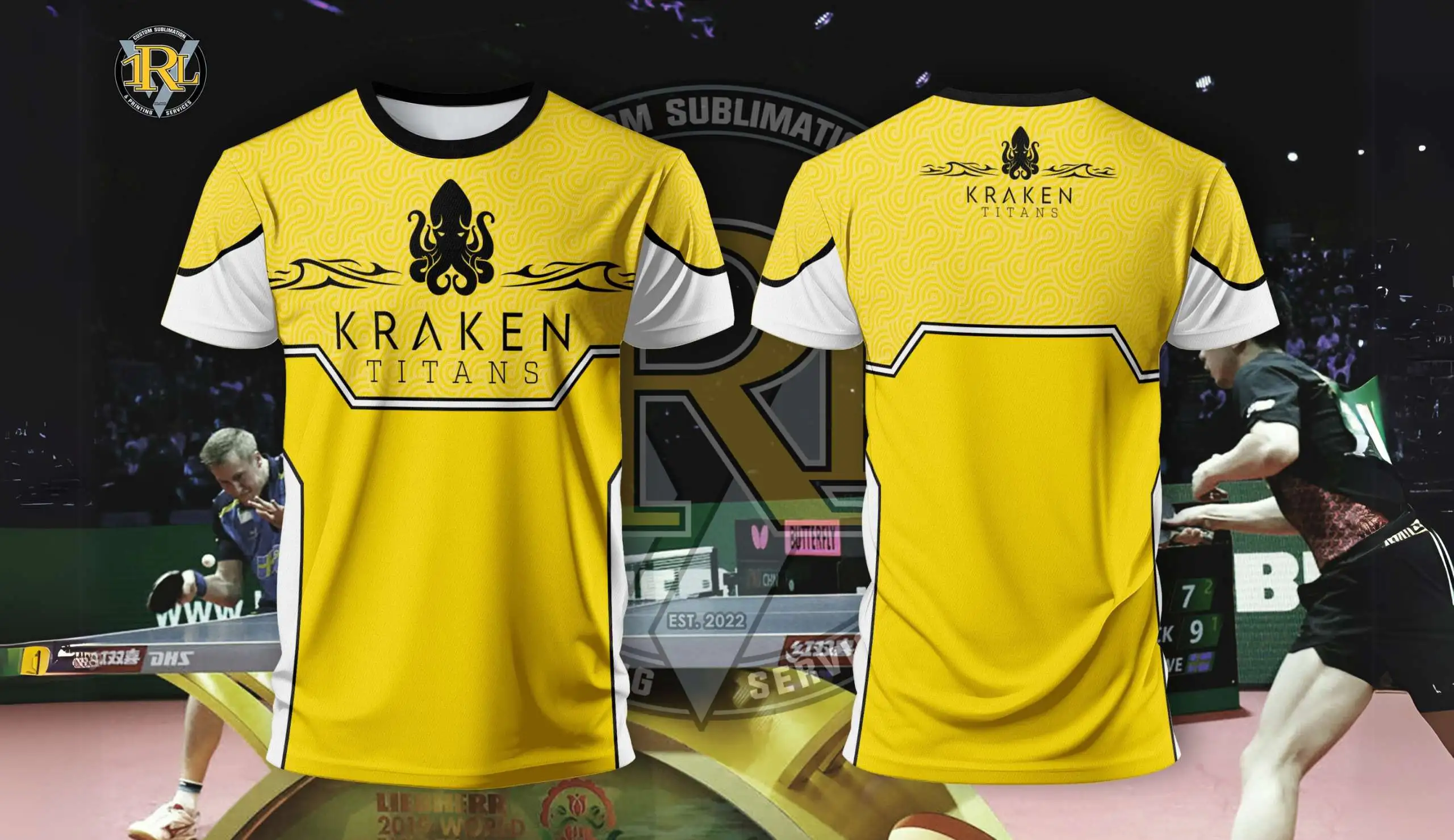 A yellow table tennis jersey with white and black accents. The front features a black kraken logo and "KRAKEN TITANS" text. The back also has the kraken logo and "KRAKEN TITANS" in smaller text. Two table tennis players are visible in the blurred background.